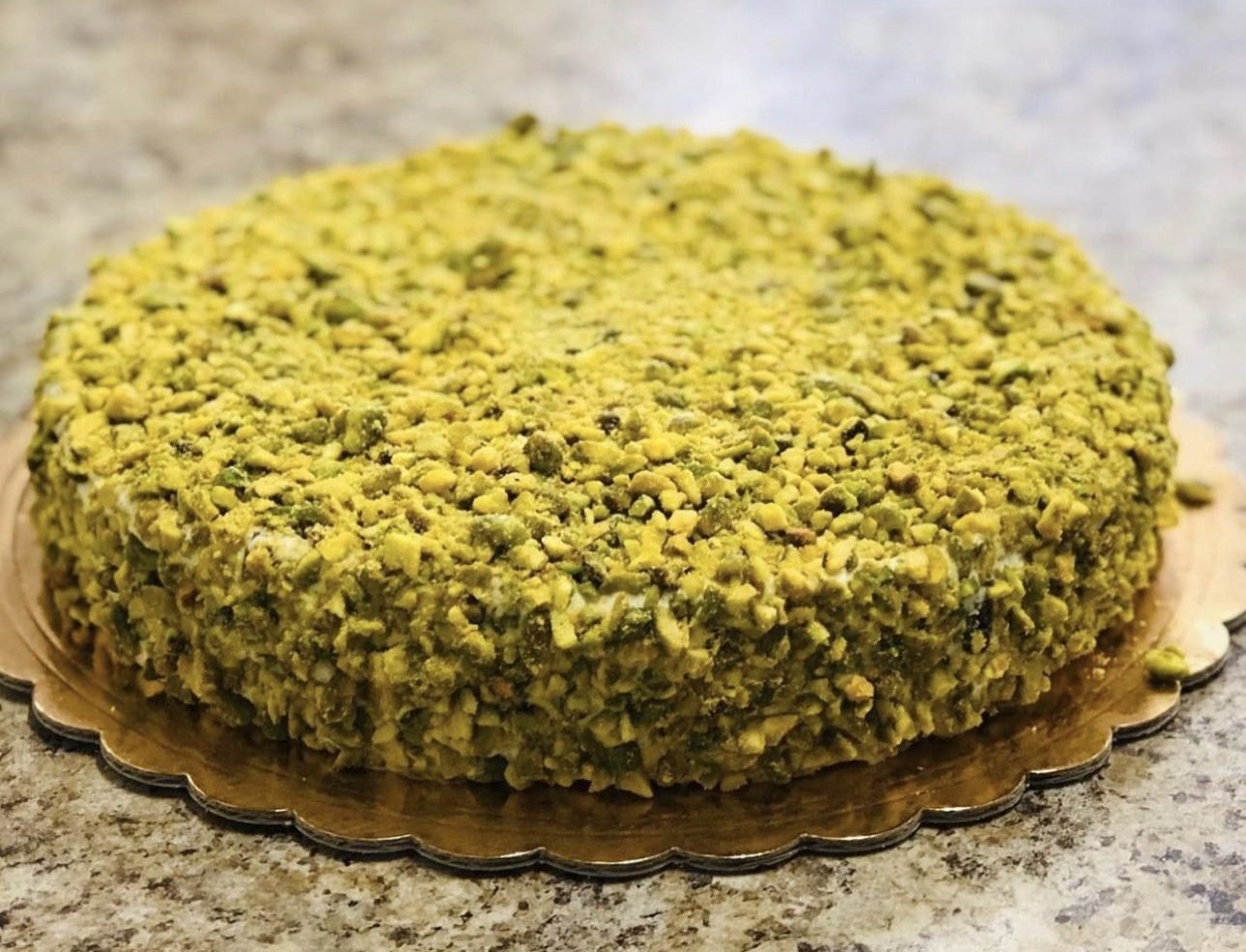 Cake covered in crushed pistachios